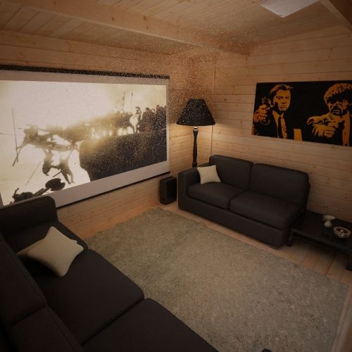 Interior of log cabin styled with two black sofas, grey rug, projector screen and portrait painting.