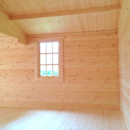 Interior view of roof, walls and window in 44mm log cabin.