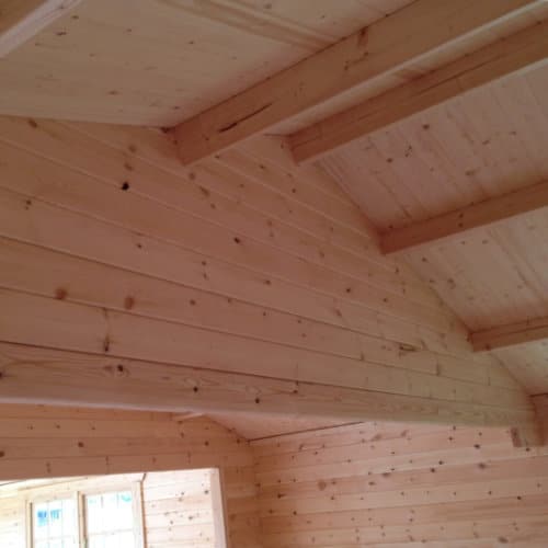 Interior view of roof structure and walls in 44mm log cabin.