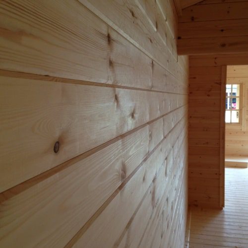 Interior view of grooved wall logs in 44mm log cabin.