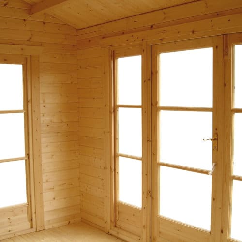 Interior view of single door and windows in 44mm log cabin.