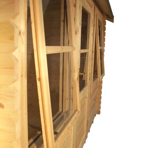 Two open windows in a 28mm log cabin, with closed single door in the middle.