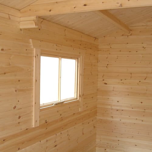 Interior of 44mm log cabin garage with Euro style window.