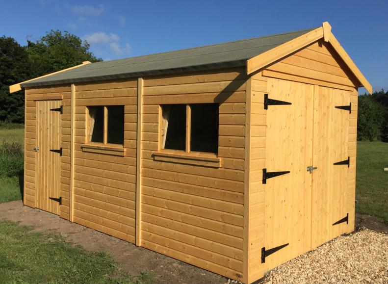 Wooden garage with lockable double doors at the front, single door at the side, two side windows and apex roof.
